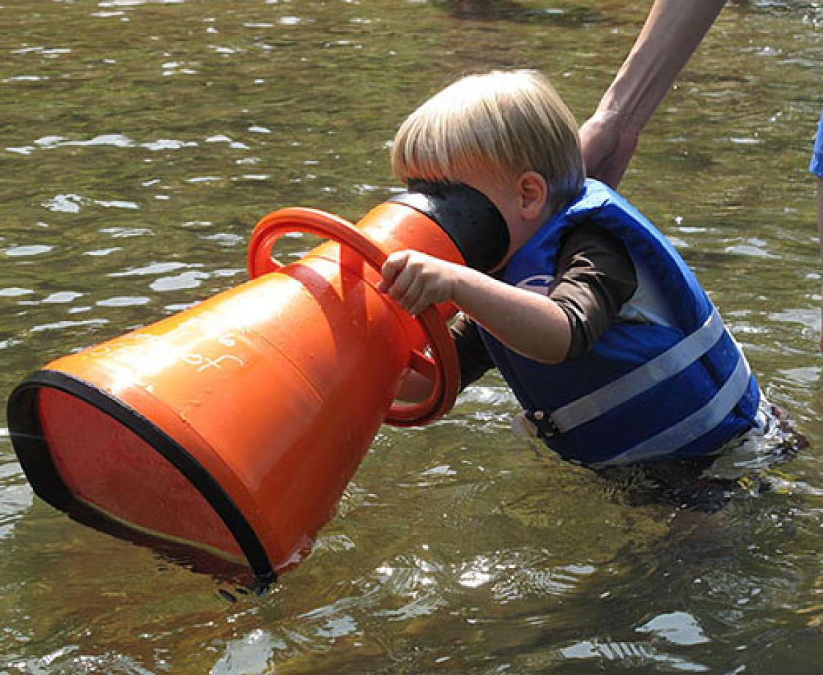 Kid looking underwater